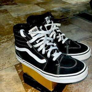 Black and white high top vans
